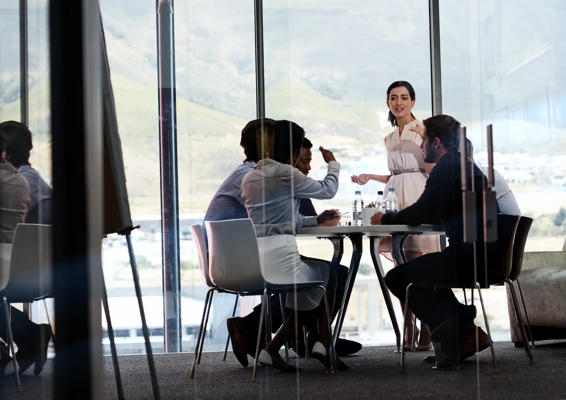 A team collaborating in a modern office meeting room