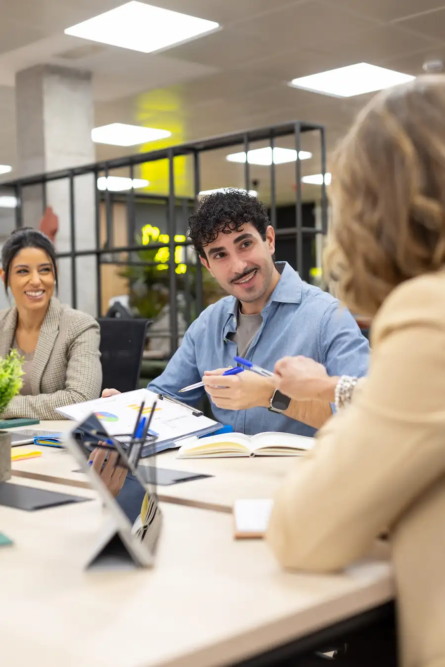 Business colleagues reviewing project information on a mobile device